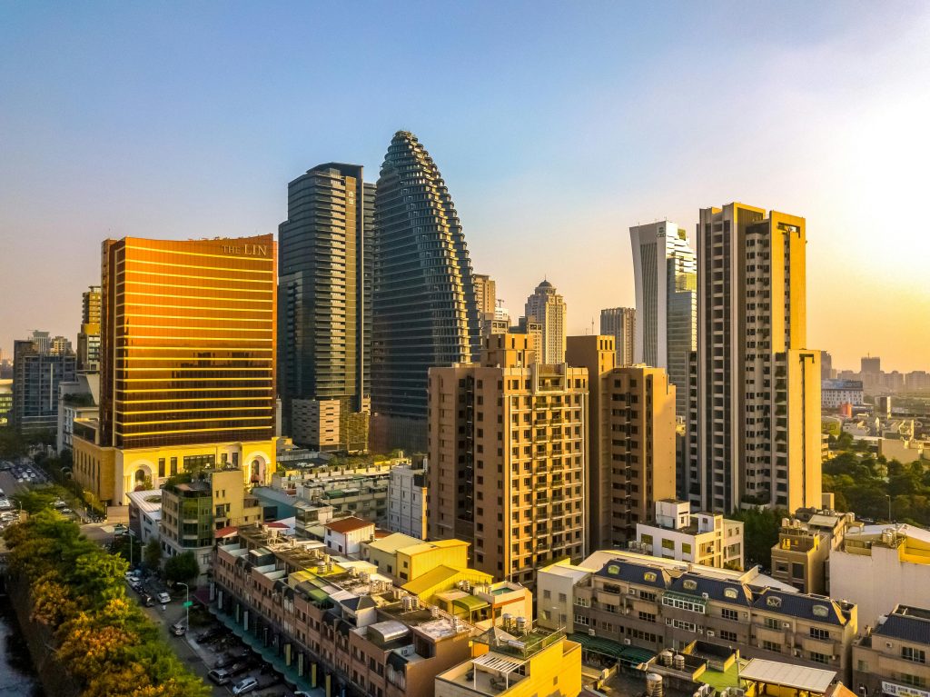Captivating aerial view of Taichung City skyline with modern skyscrapers at sunset, showcasing urban architecture in Taiwan.