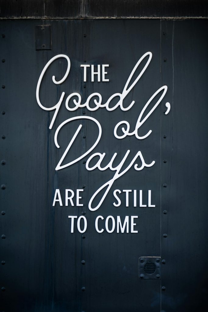 Close-up of a motivational quote on a textured wall in Waco, Texas.